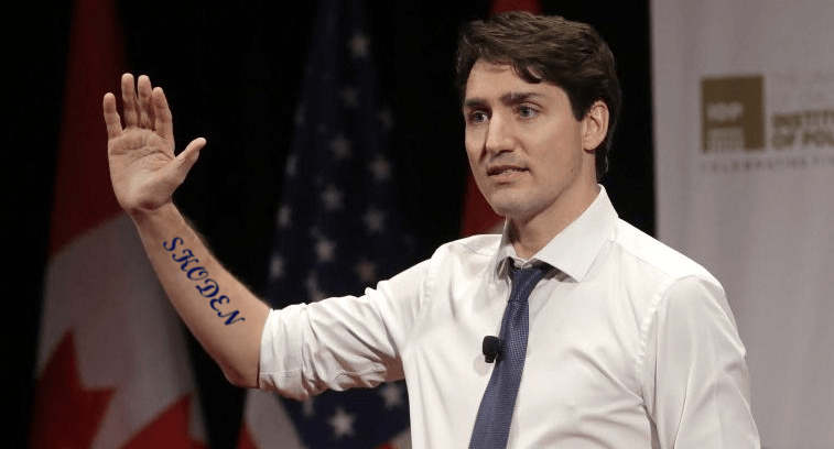 Sudden appearance of Trudeau's 'Skoden' tattoo greeted with boos – Walking  Eagle News