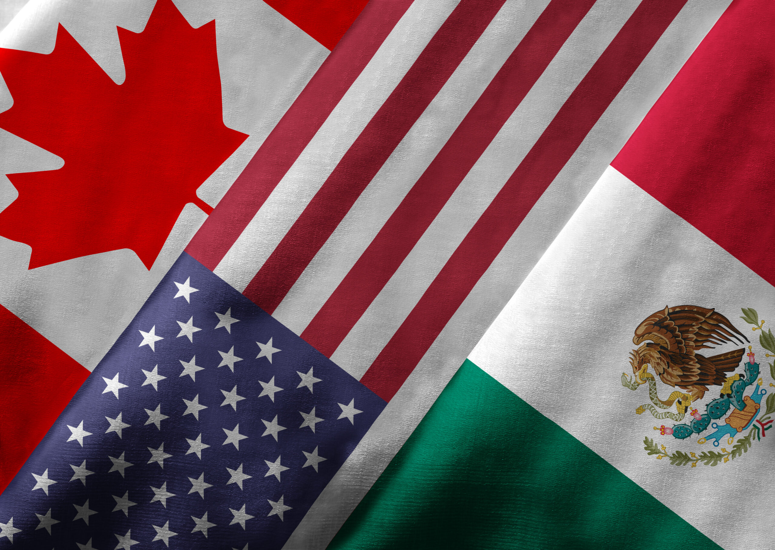 Image of Canadian, American and Mexican flags.